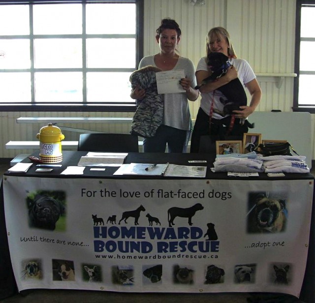 Homeward Bound's booth with Susie and Kilo the Pug