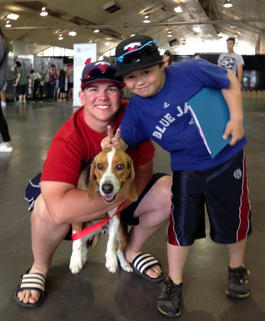 Boys pose with adopted rescue dog, George