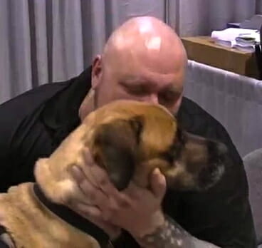 Man and Dog Kiss