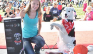 Sara and Hero pose with grand prize at woofstock