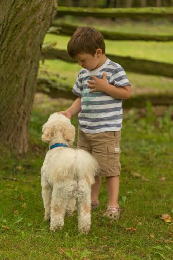 Henry says "hello" to little boy