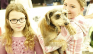 girl pose with terrier puppy