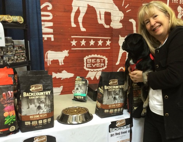 Susie and Kilo checking out new food from Merrick at Canadian Pet Expo