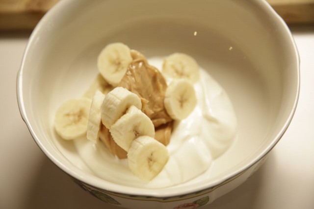 Mixing Dog Licks banana and peanut butter dog-friendly ice cream in a bowl