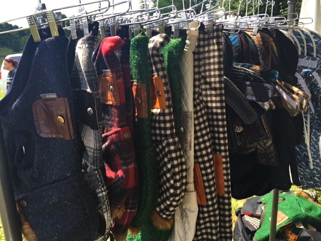 Dog clothes hanging on display at Dog Tales Festival