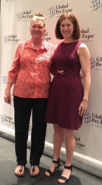 Lori Nelson and survivor Trish Steffen speaking on behalf of Noah's Animal Shelter at Bayer Media Luncheon at Global Pet Expo