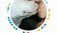 Valentine's Dog Contest white dog licking woman's face