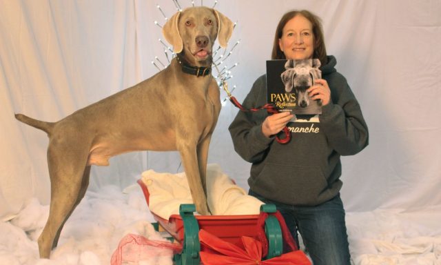 Joanne with her beautiful dog Comanche and her new book at the Toronto Christmas Pet Expo